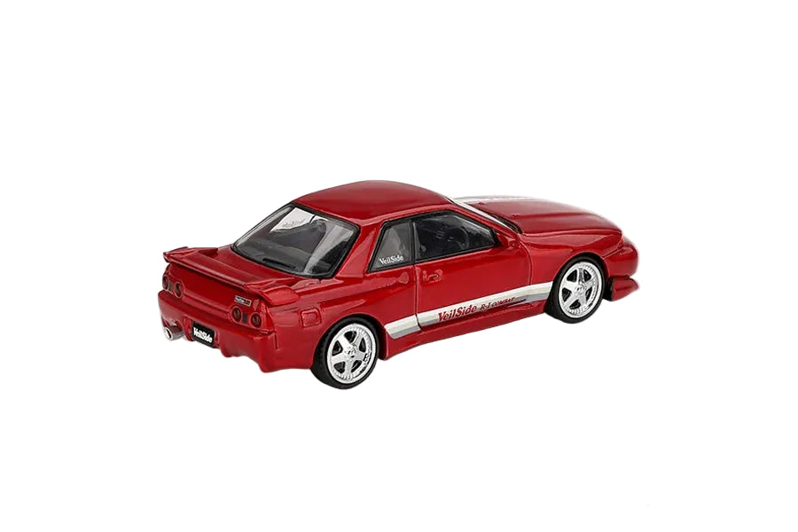 Mini GT Nissan Skyline GT-R R32 VeilSide Combat C-I Gem Red RHD rear three-quarter view showing the rear wing, lights and VeilSide graphics