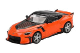 Mini GT Nissan Z VeilSide FFZ400 Orange RHD front three-quarter view showing the orange body, black bonnet insert and silver wheels