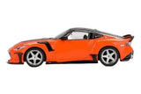 Mini GT Nissan Z VeilSide FFZ400 Orange RHD side profile showing the wide bodywork, black side vent and silver wheels