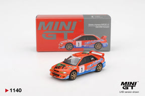 Mini GT Subaru Impreza WRC97 No.1 1999 DRM Champion LHD diecast rally car with orange and blue Norisbank livery, gold wheels and collector box