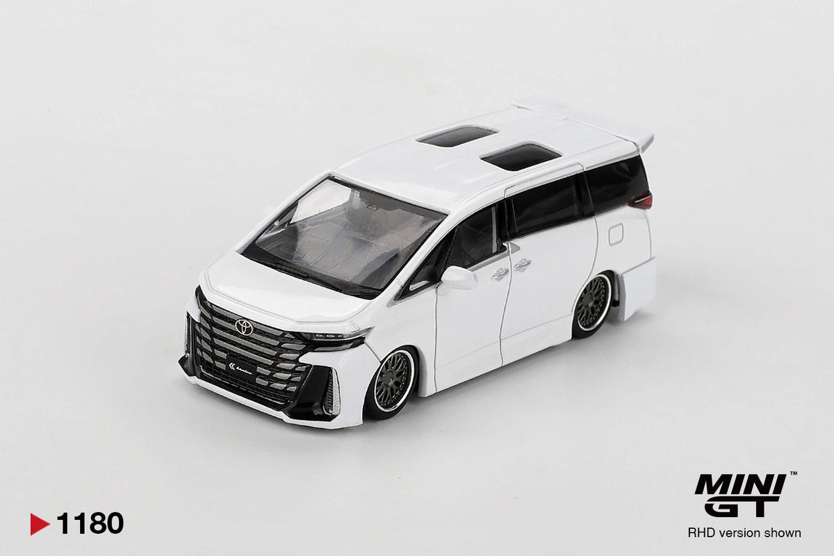 Front three-quarter view of Mini GT Toyota Vellfire 40 KUHL White RHD showing the large black Toyota grille, KUHL front bumper, lowered bodywork, custom wheels and twin roof windows.