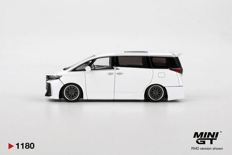 Side profile of Mini GT Toyota Vellfire 40 KUHL White RHD showing lowered suspension, dark multi-spoke wheels, black tinted windows and white bodywork.