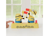 Hand pressing the red button on the left side of the Minions Hammer POP game