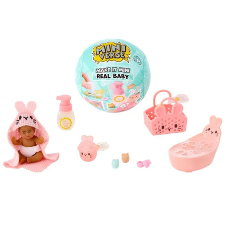 Miniverse Make It Mini Real Baby Nurture turquoise surprise capsule displayed with a miniature baby in a pink bunny hooded towel, pink bunny bath, bottle, animal face basket and tiny baby care accessories.