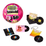 MGA's Miniverse Real Music pink surprise capsule displayed with miniature vinyl records, album sleeves featuring Britney Spears, Imagine Dragons and The Beach Boys, a black record crate and keychain accessory.