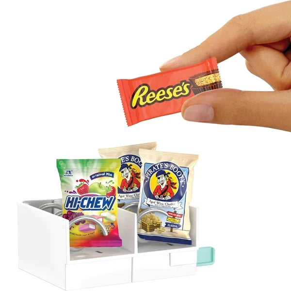 Miniature snack products for the teal Miniverse Real Brands Vending Machine, featuring Reese's and Pirate's Booty branded packaging against a white background.