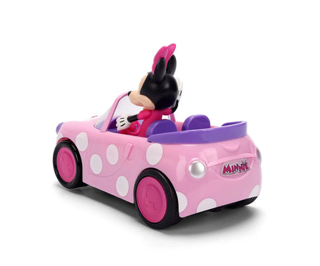 Minnie RC Roadster viewed from the rear and side, showing the pink body with white polka dots, purple seats, pink wheels and Minnie logo on the boot.