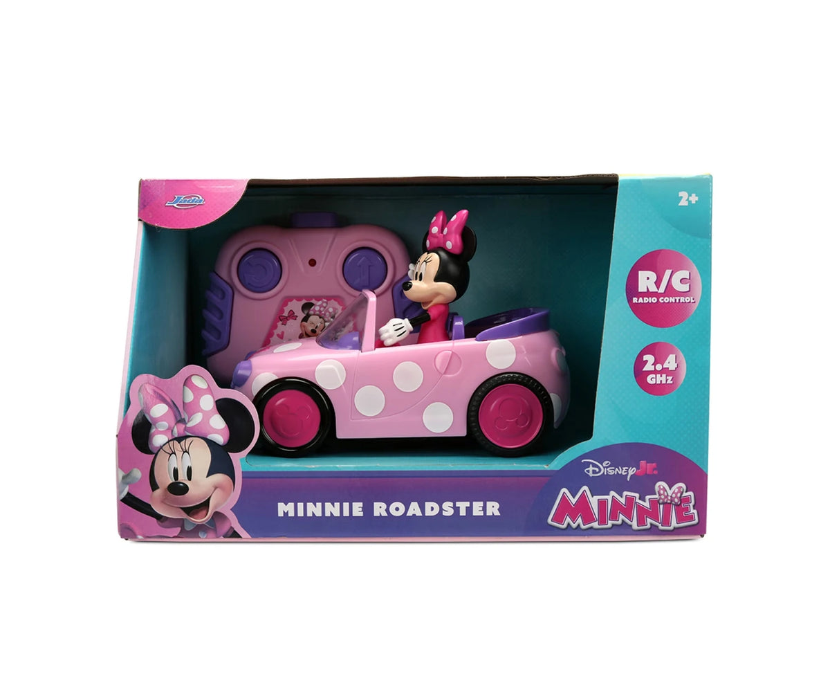Disney Junior Minnie RC Roadster retail packaging showing the pink polka dot car with Minnie Mouse driving, the included remote controller and 2.4 GHz radio control branding.