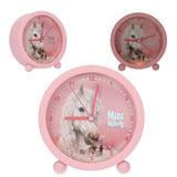 Miss Melody alarm clock shown with front close-up and angled side view