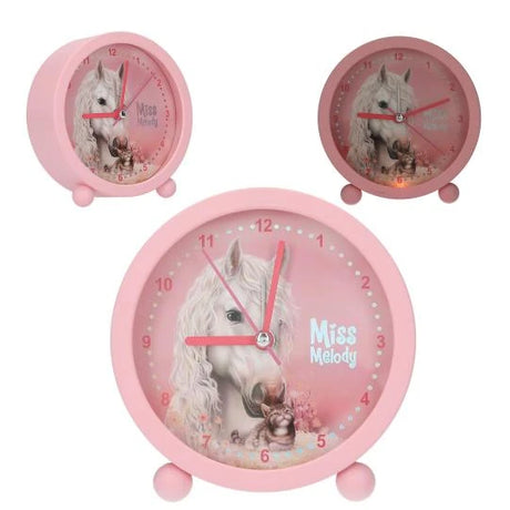 Miss Melody alarm clock shown with front close-up and angled side view