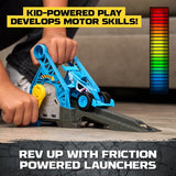 Child turning the yellow crank on a blue Monster Jam friction powered launcher, with a blue Megalodon truck positioned on the black starting ramp and a coloured power indicator graphic.