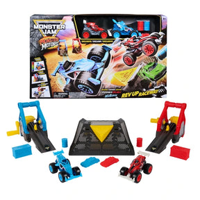 Monster Jam Monster Motors Rev Up Raceway retail box displayed above the separate track components, including red and blue friction launchers, yellow cranks, black finish ramp, two monster trucks and coloured obstacles.