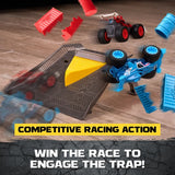 Monster Jam Rev Up Raceway finish ramp with a yellow trapdoor, a blue monster truck overturned beside the ramp, a red truck behind it and broken red and blue obstacles scattered across the floor.