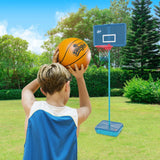 Mookie All Surface Basketball hoop on grass with a child holding an orange basketball