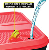 Mookie Classic All Surface Swingball red base with yellow water plug and water pouring in