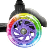 A close view of a lilac MoVe Tilt and Glo scooter wheel with rainbow coloured light up detailing and purple wheel spokes