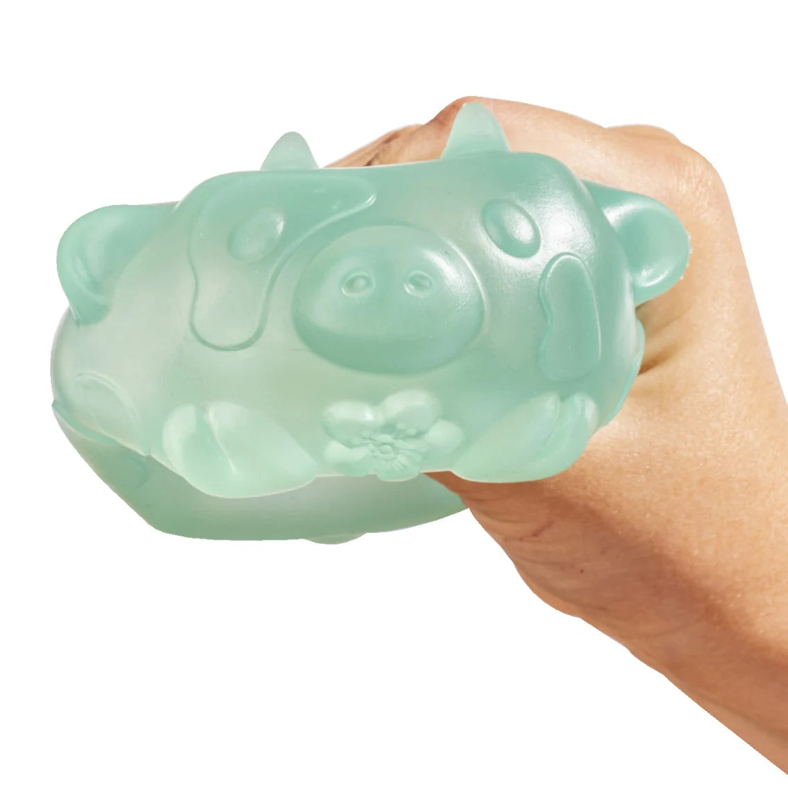 Mint green MushyKinz Jelleez dog squishy being squeezed in a hand
