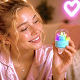 Blue Music Creator Mini Speaker with coloured lights held in one hand