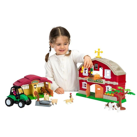 Child playing with My Country Farm House Playset beside red barn, horse stable, green tractor, water pump, tree, horse, sheep and cow