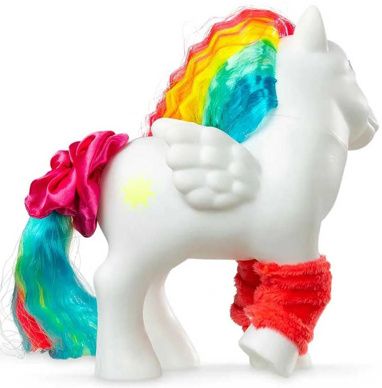 Rear side view of My Little Pony Totally Rad Starshine showing white Pegasus wings, yellow star symbol, colourful crimped rainbow mane, pink tail scrunchie and orange fuzzy legwarmers.