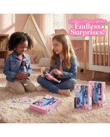 Two children sitting on the floor with My Mini Baby dolls, babies, accessories and pink boxes