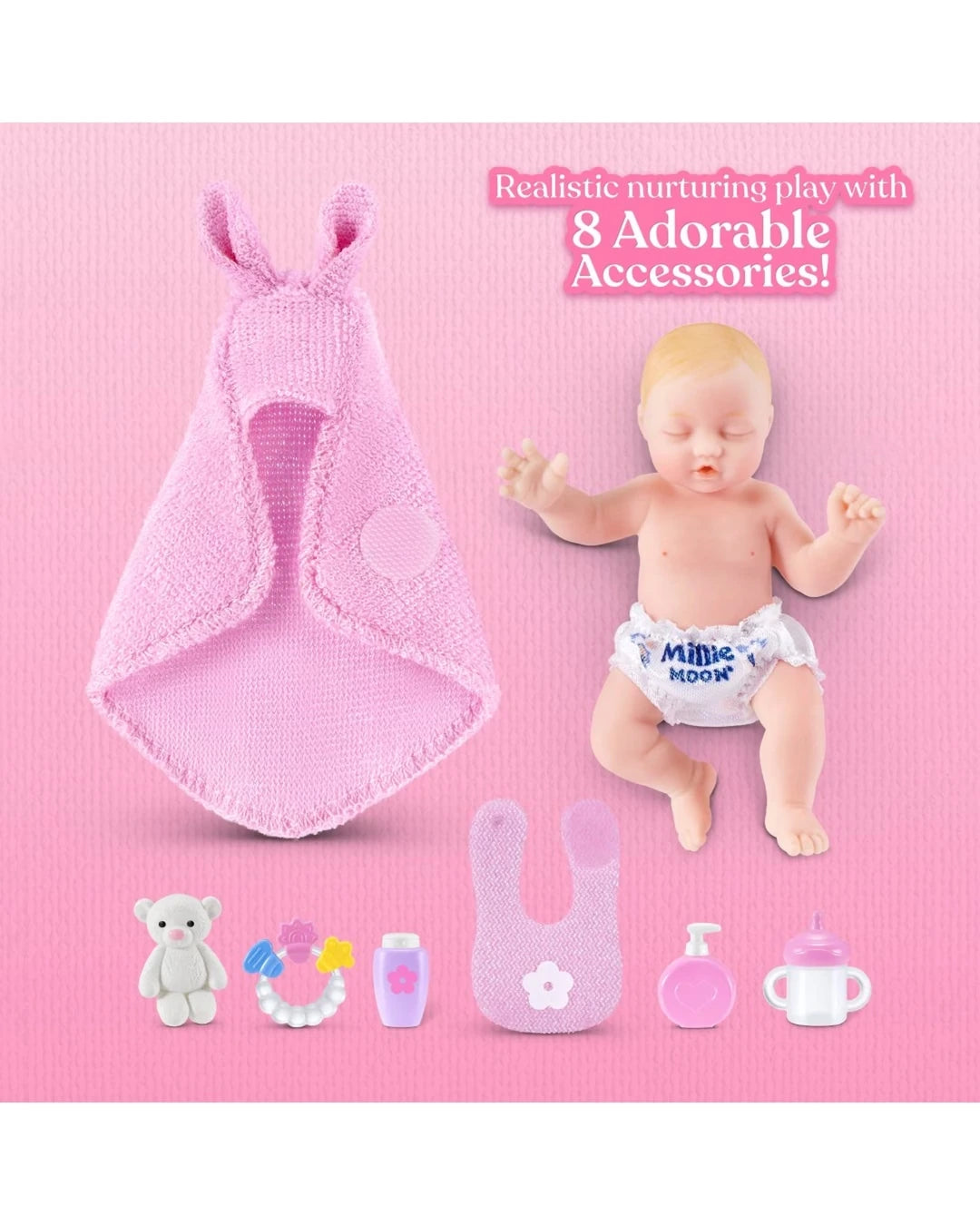 My Mini Baby newborn with pink swaddle and eight baby accessories including teddy, bottle, bib and cup