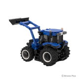 Angled view of the BRIXIES Plus New Holland T6.180 showing the raised loader arms, enclosed cab, blue rear bodywork and agricultural tyres