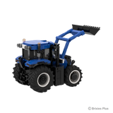 BRIXIES Plus New Holland T6.180 shown from the rear side with the raised front loader, enclosed cab, blue body panels and large rear wheel