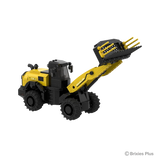 Front three quarter view of the BRIXIES Plus New Holland W170D+ showing the articulated front section, large tyres, cab and raised attachment