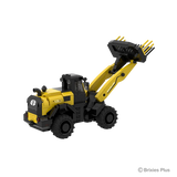 Rear three quarter view of the BRIXIES Plus New Holland W170D+ showing the rear grille, round tail lights, cab and raised loader arm