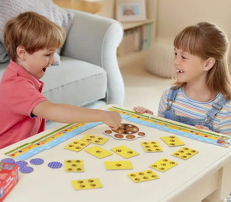 Two children playing Spotty Sausage Dogs Game from Orchard Toys Ireland