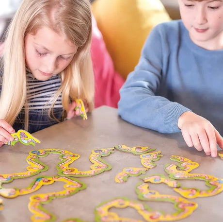 Kids playing Orchard Toys Wiggly Words Game at home in Ireland