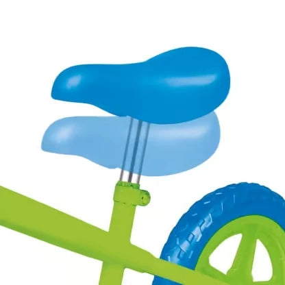 Close up of the Ozbozz My First Balance Bike blue saddle, green frame and rear wheel