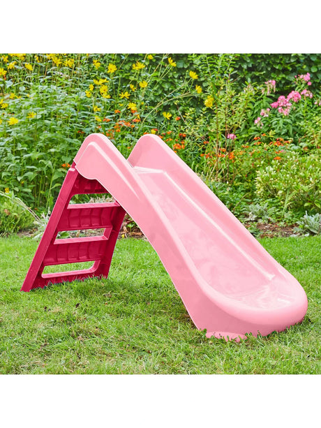 Pink and red folding first slide opened on grass