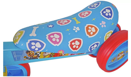 Close up of PAW Patrol Bobble Ride On blue seat with paw print and bone pattern