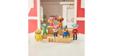 PAW Patrol Fire Rescue figures arranged on wooden blocks with Ryder and six pup figures