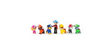 Ryder and six PAW Patrol pup figures shown in a straight lineup wearing fire rescue helmets