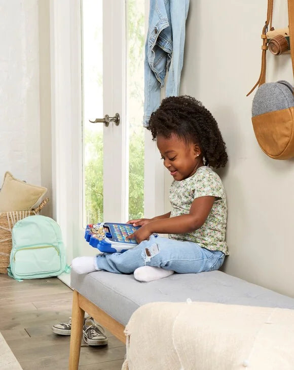 Child playing with the PAW Patrol Light-Up Missions Pup Pad toy – Ireland.