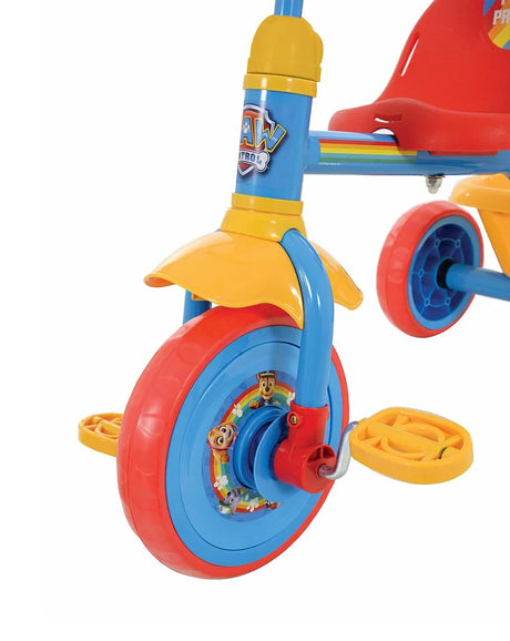 Close up of PAW Patrol My First Trike front wheel, yellow pedal, red mudguard and blue fork