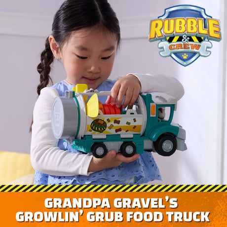 Child playing with the Paw Patrol Rubble & Crew Growlin’ Grub Food Truck Playset