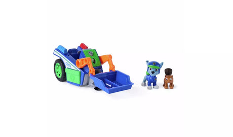 PAW Patrol Rocky figure and brown animal figure standing separately beside the Rescue Recycler vehicle with scoop lowered