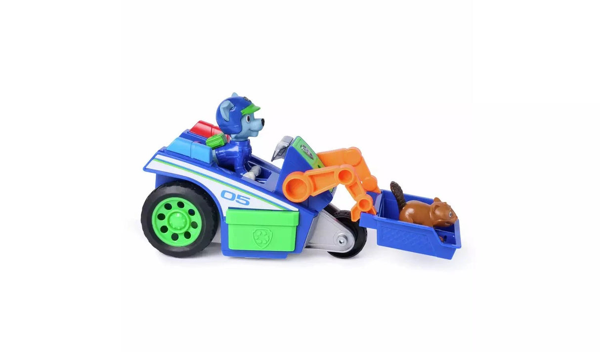 PAW Patrol Rocky Rescue Recycler viewed from the side with orange claw arm raised and brown animal figure in the blue scoop
