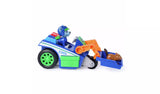PAW Patrol Rocky Rescue Recycler viewed from the side with orange claw arm raised and brown animal figure in the blue scoop