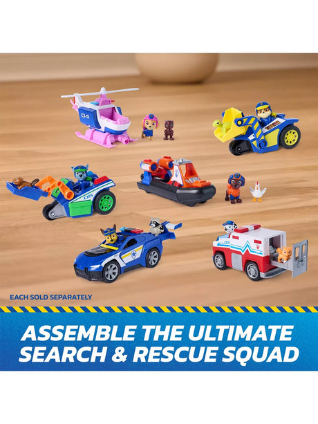 PAW Patrol Search & Rescue figures and vehicles shown together on a wooden floor