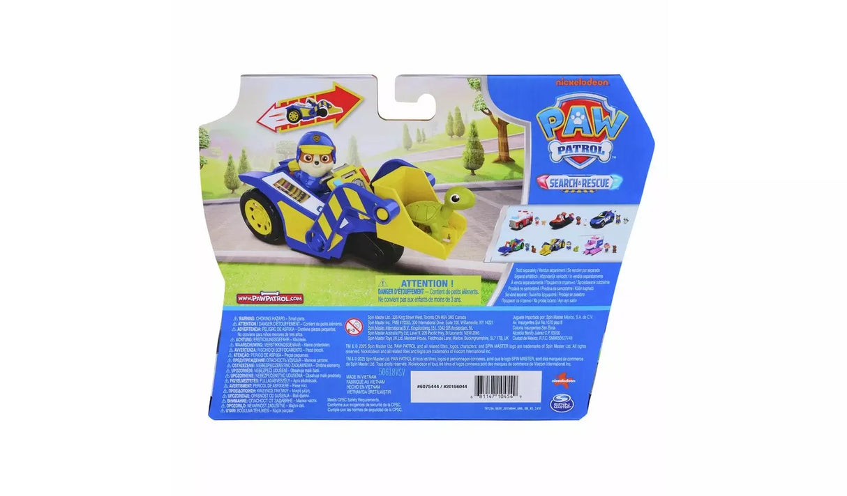 Back of PAW Patrol Search and Rescue Rubble Rescue Bulldozer packaging showing product in use with multilingual safety warnings and age 3 plus rating