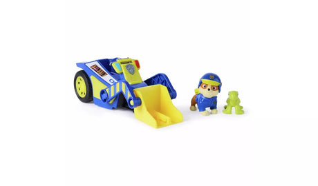 Rear three-quarter view of PAW Patrol Rubble Rescue Bulldozer showing yellow scoop blade lowered with Rubble and green turtle figures displayed separately alongside