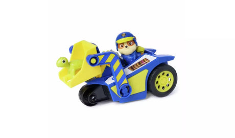 Blue and yellow PAW Patrol Rubble Rescue Bulldozer with Rubble figure seated in vehicle and small green turtle figure on white background