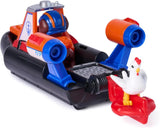 Close-up rear angle of PAW Patrol Zuma Rescue Hovercraft showing blue and orange launcher arm, black hull, and white chicken figure alongside
