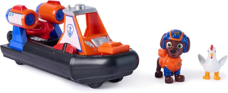 Orange and black PAW Patrol Zuma Rescue Hovercraft with Zuma figure in orange suit and small white chicken figure on white background