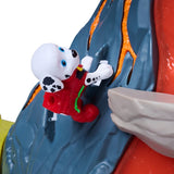 Marshall figure climbing the side of the PAW Patrol Super Lava Blast volcano playset